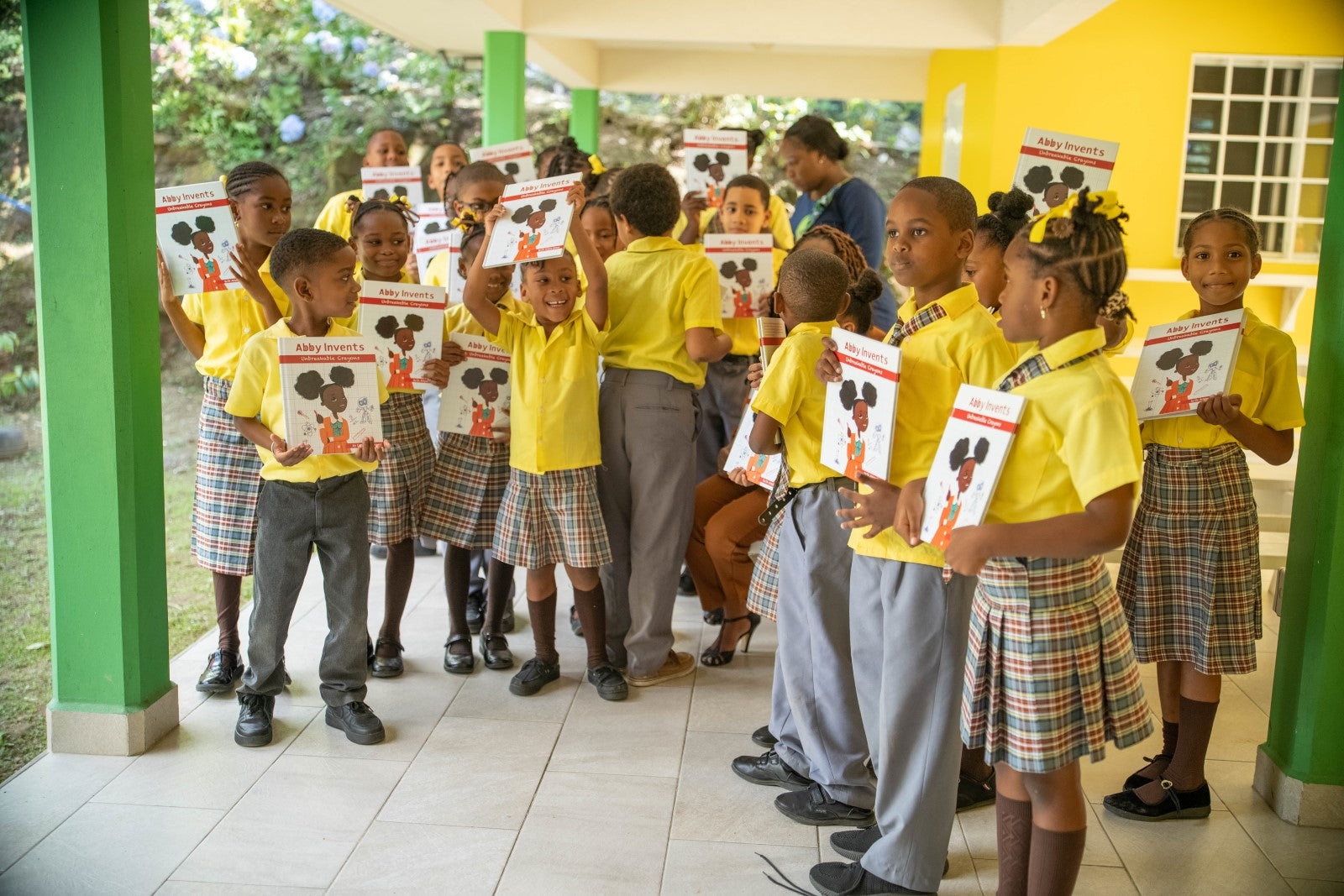 Kids in Dominica with Abby Invents books